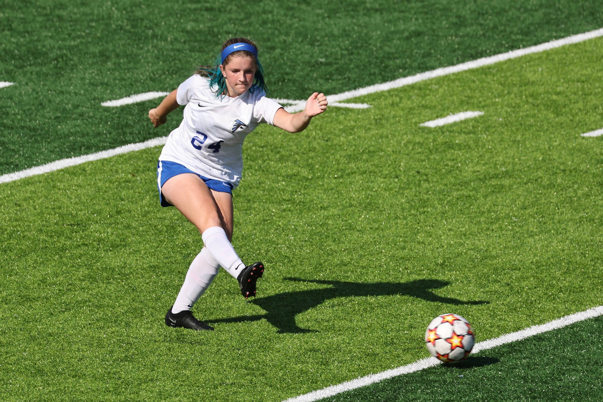 Photo by John Fisken
Sophomore Baylie Kuschnereit, a defensive midfielder for South Whidbey, aims a kick.