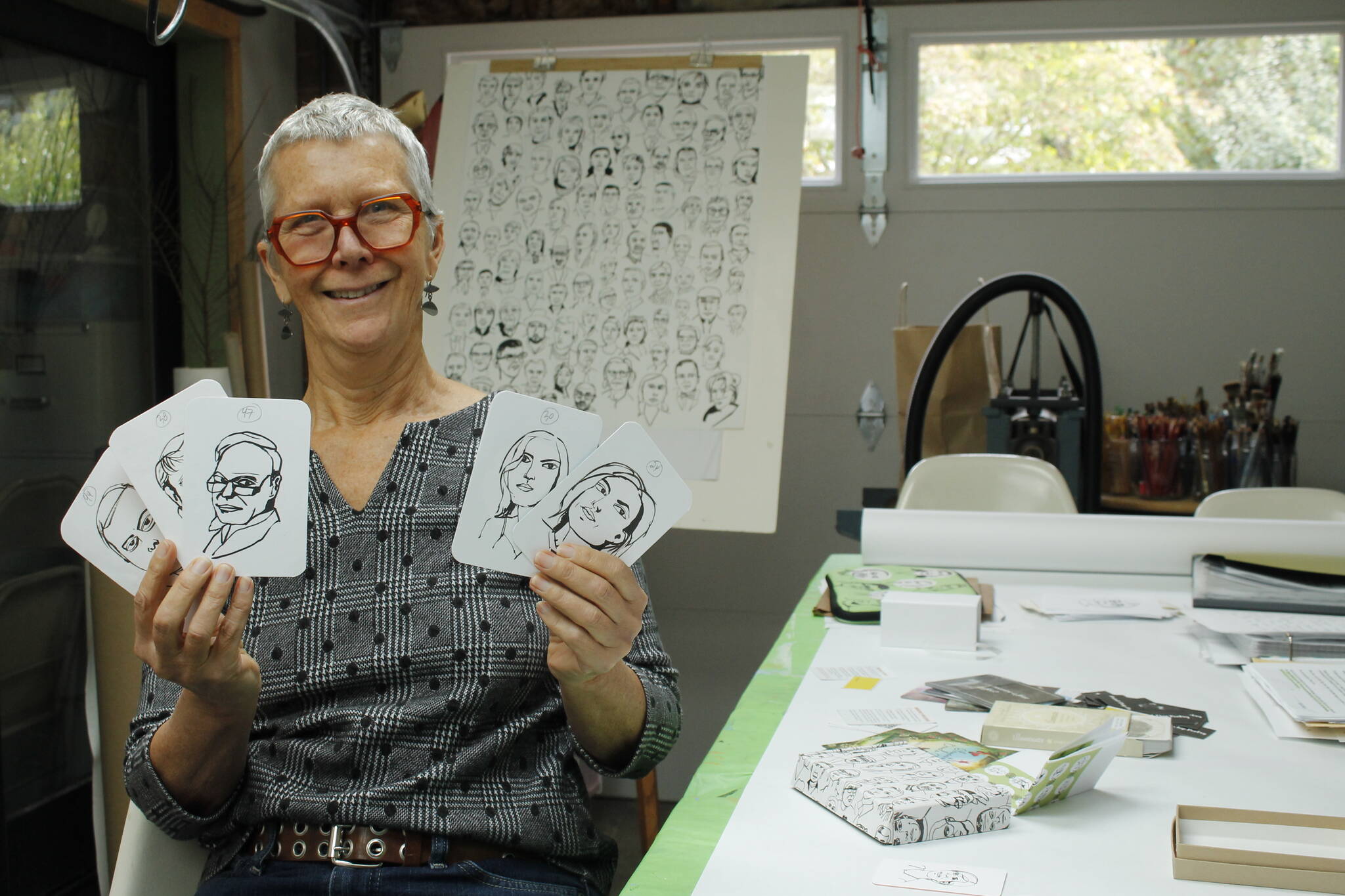 Photo by Kira Erickson/South Whidbey Record
Langley artist Meredith MacLeod displays cards printed with her portraits and writing prompts.