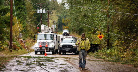 Photo by David Welton
Repair crews work to restore power to Whidbey Island after aggressive winds took out power lines and poles over the weekend.