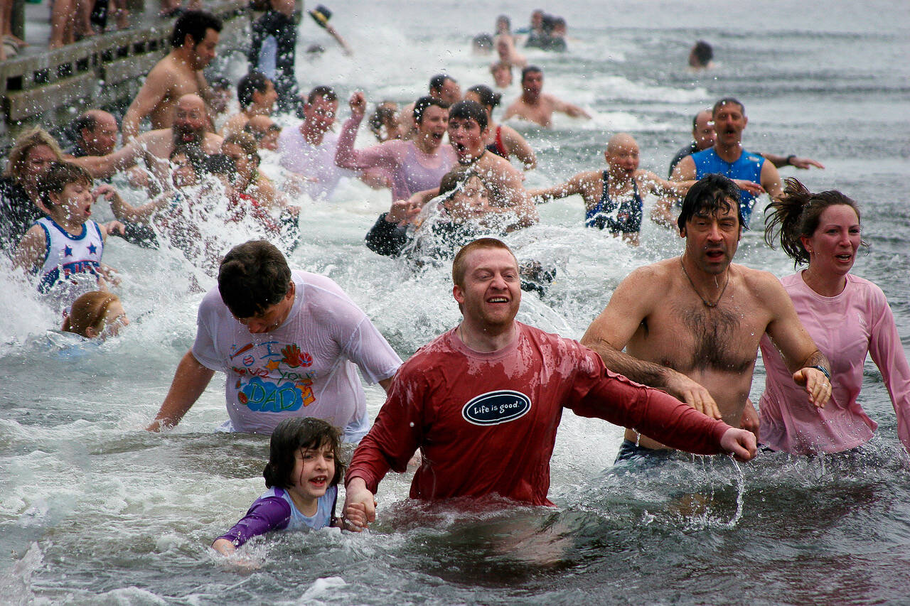 Photo by David Welton
Participants of the Polar Bear Plunge take an icy dip.