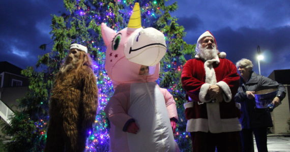 File photo by Karina Andrew/Whidbey News-Times
Some unconventional helpers join Santa at the Oak Harbor tree lighting in 2021.