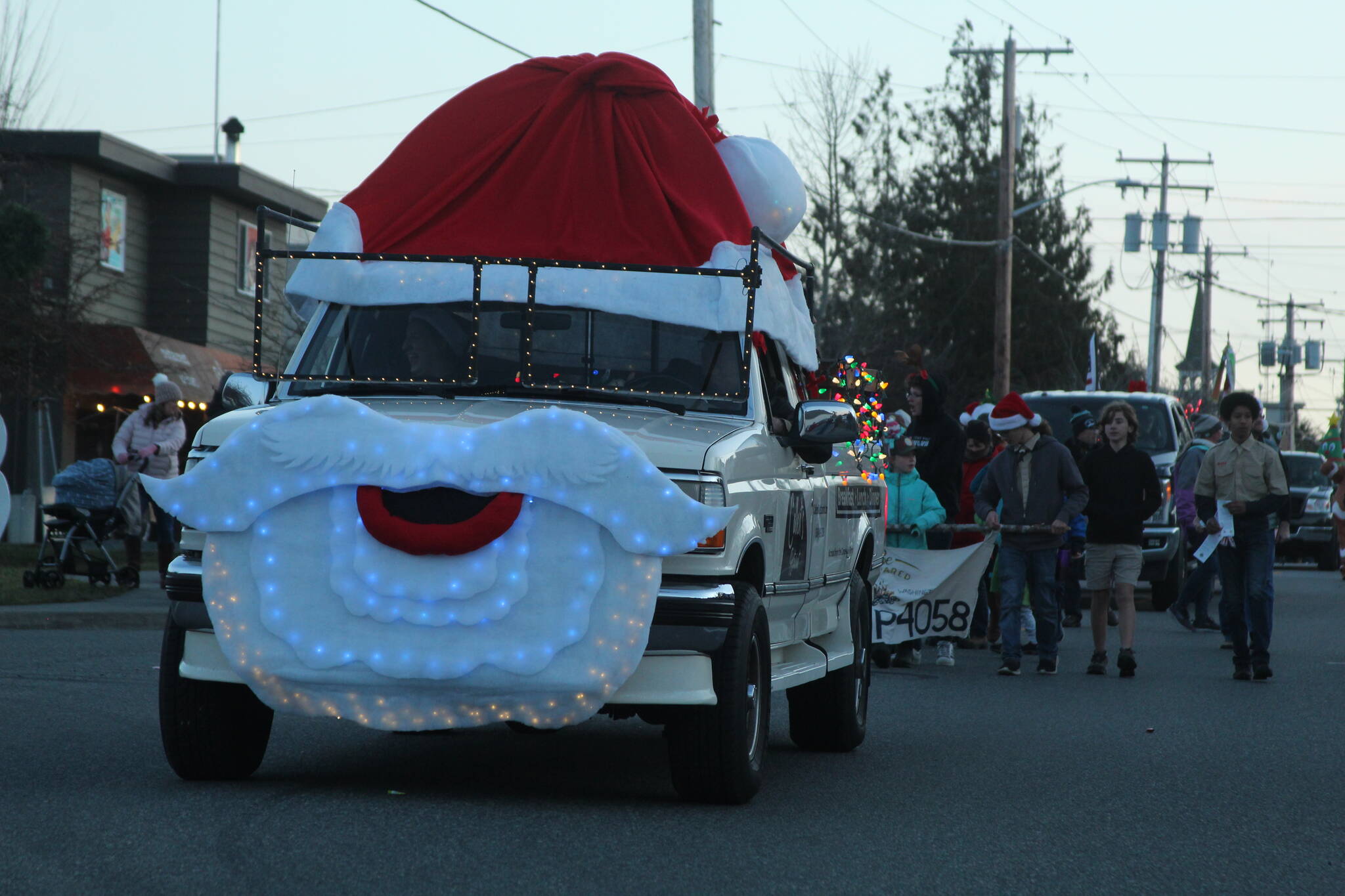 Photo by Karina Andrew/Whidbey News-Times
A truck decked out like St. Nick himself trundles down Main Street during the Greening of Coupeville.