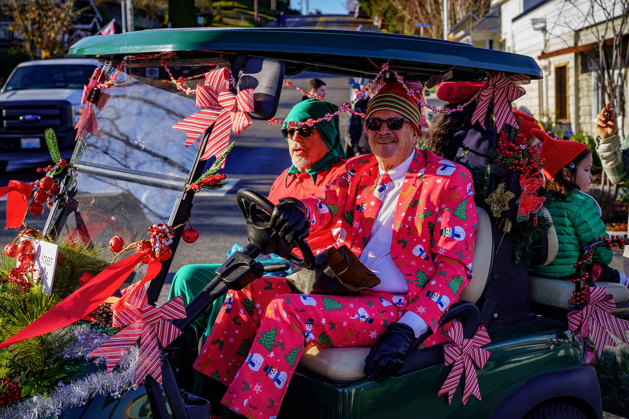 Photo by David Welton
Former Langley Mayor Tim Callison, right, showed up to the Holly Jolly Parade in style.