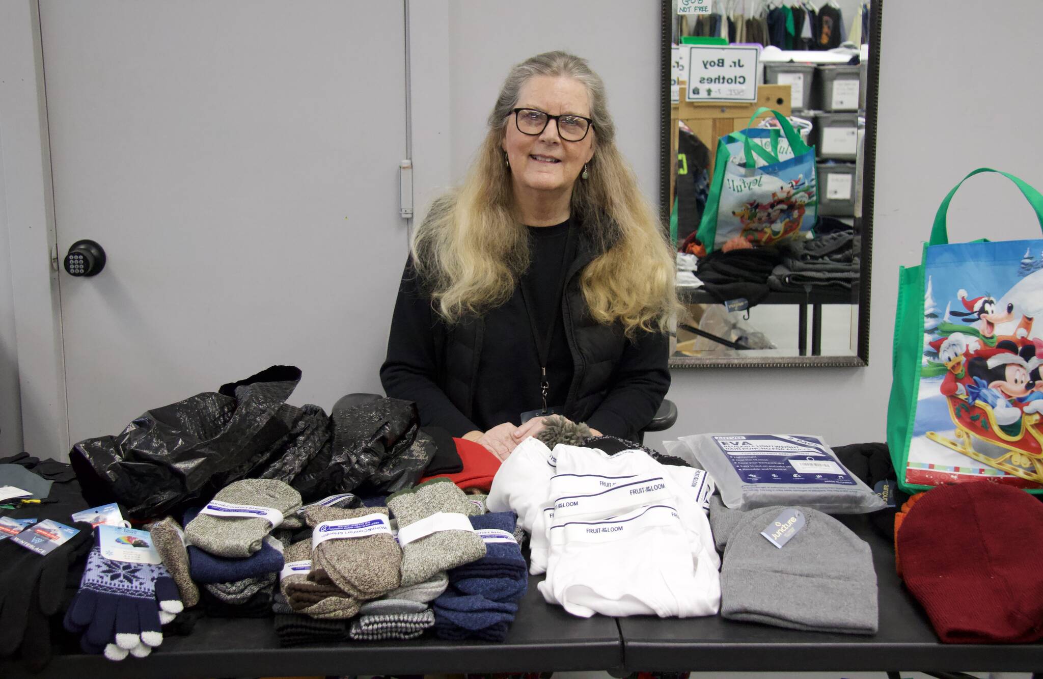 Photo by Rachel Rosen/Whidbey News-Times
Garage of Blessings volunteer Jane Brent organized one of the nonprofit’s holiday events this year. She handed out brand new scarves, hats, gloves and other clothing needed for winter.