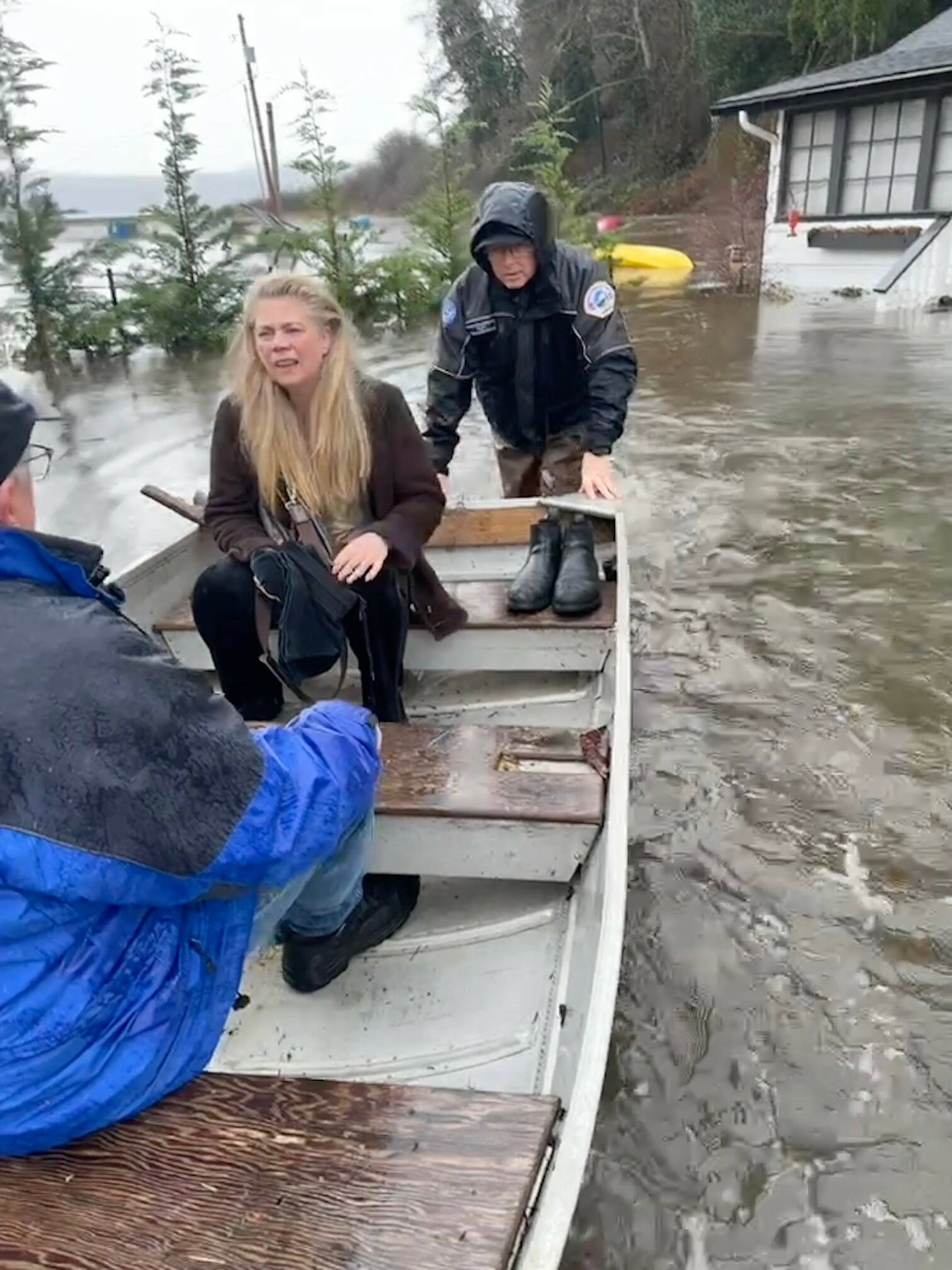 Central Whidbey Island Fire and Rescue firefighters rescue a woman who was marooned in her flooded home in Greenbank. (Photo provided)