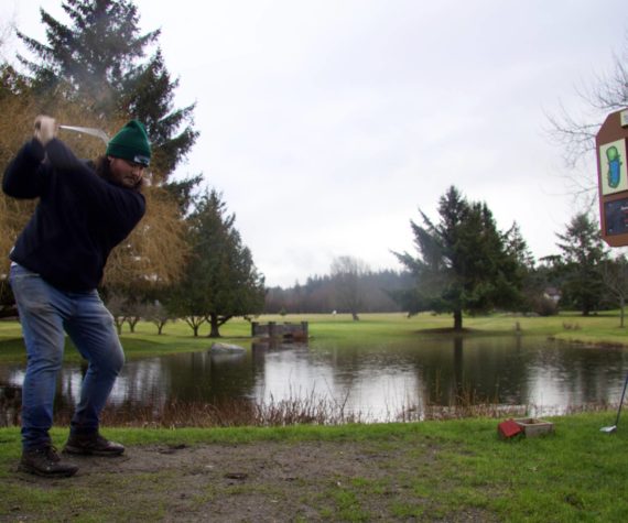 Photo by Rachel Rosen/Whidbey News-Times
Ian Kenney, who owns Deception Pass Golf Center with his father Don, tees off at the course’s most picturesque hole.