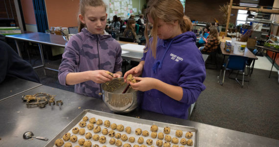Photo by David Welton
Fifth graders Brooklyn Simmons, left, and Sadie Rich shape the dough for cookies made during South Whidbey Elementary School’s MLK Day of Service.