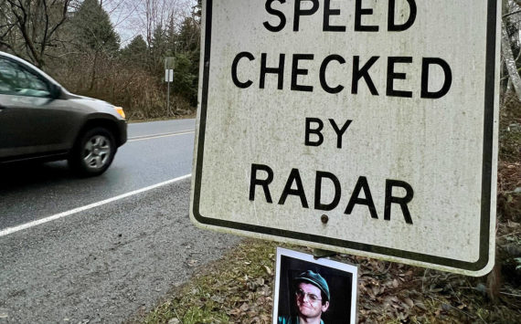 A photo of “M*A*S*H” character Corporal Walter "Radar" O’Reilly has mysteriously returned to the “Speed Checked by Radar” sign on Third Street coming into Langley on Whidbey Island on Jan. 2, 2023. (Andrea Brown / The Herald)