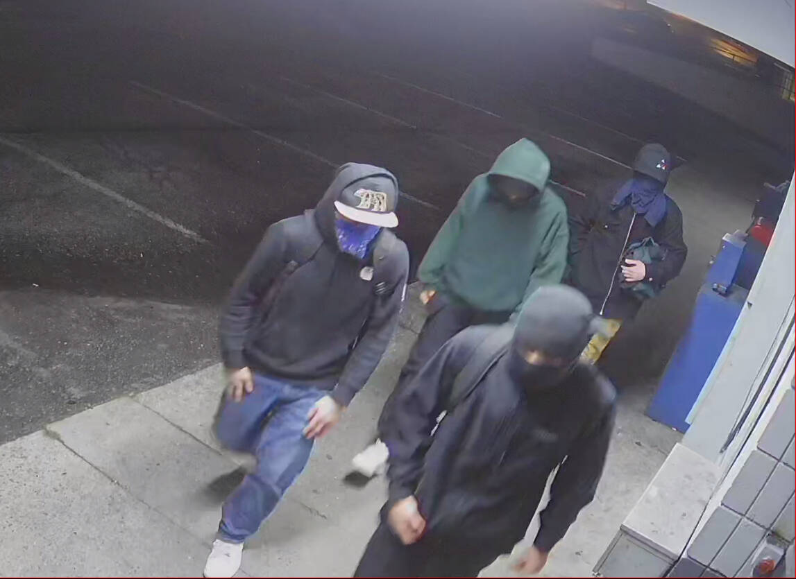 A group of teenagers in masks were caught on video trying to break into an Oak Harbor shop. (Provided by Oak Harbor police)