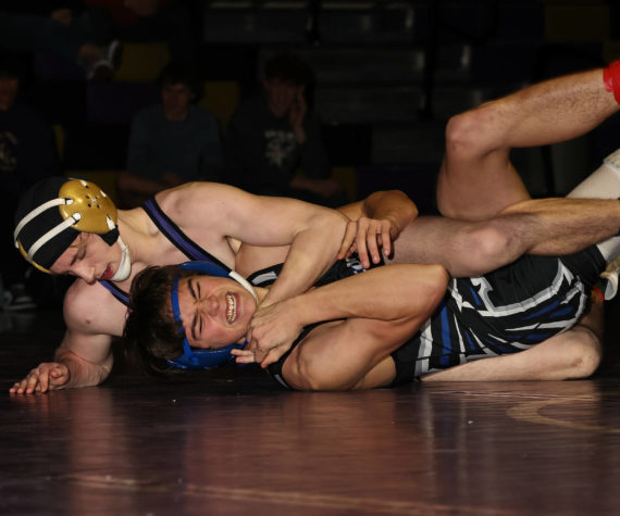 <p>Photo by John Fisken</p>
                                <p>Oak Harbor athelte Percie Hatfield pins an oppnent at a Jan. 17 wrestling match aginst South Whidbey. The boys varsity wrestling team won 55-24.</p>
                                <p>“South Whidbey was a great match for us. The Falcons challenged us at a lot of our stronger weight classes, winning some matches against our better wrestlers,” said head coach Perer Esvelt. “Our communities are close when it comes to wrestling, so seeing a competitive match between us is great, as we can partner in the off-season and see both teams improve.”</p>