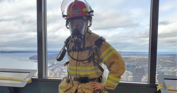 Photo provided
South Whidbey resident Jim Towers stands at the top of the Columbia Center after last year’s firefighter stairclimbing event in Seattle.