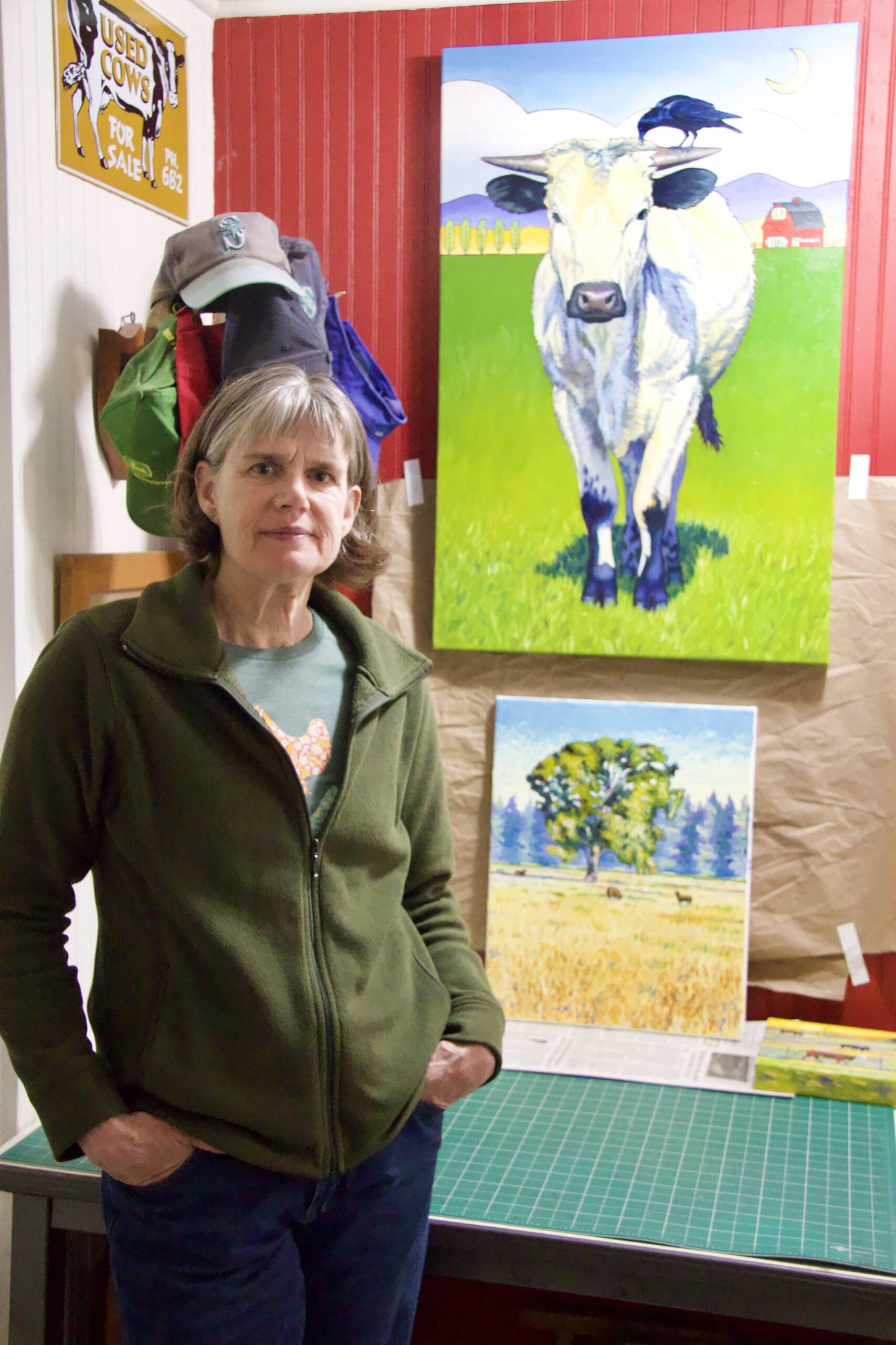 Photo by Rachel Rosen/Whidbey News-Times
Stacey Neumiller stands in front of her paintings.