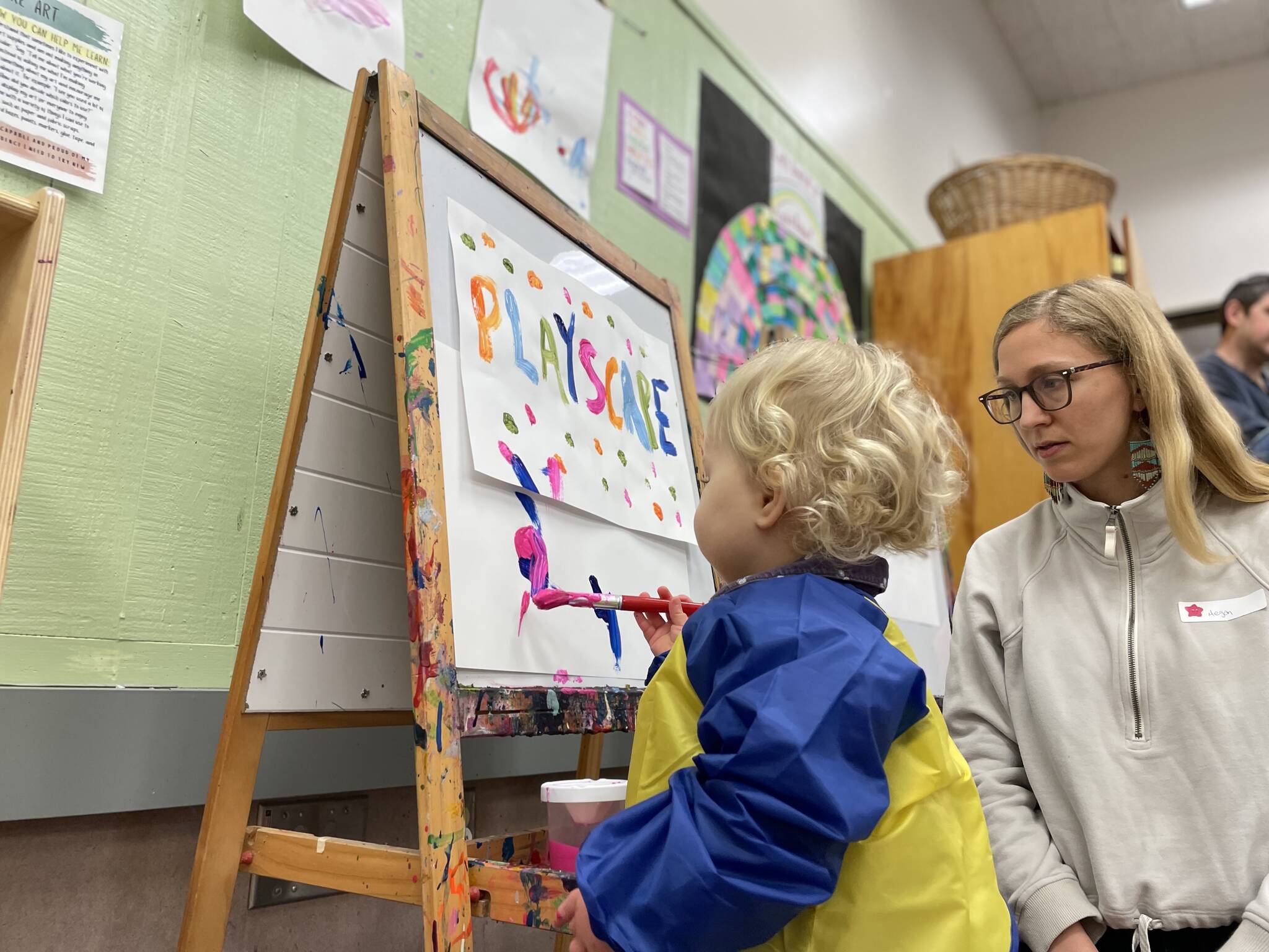 Photo provided
Sage, 17 months, paints a picture at Playscape while her mom, Megan Ostermick-Durkee, looks on.