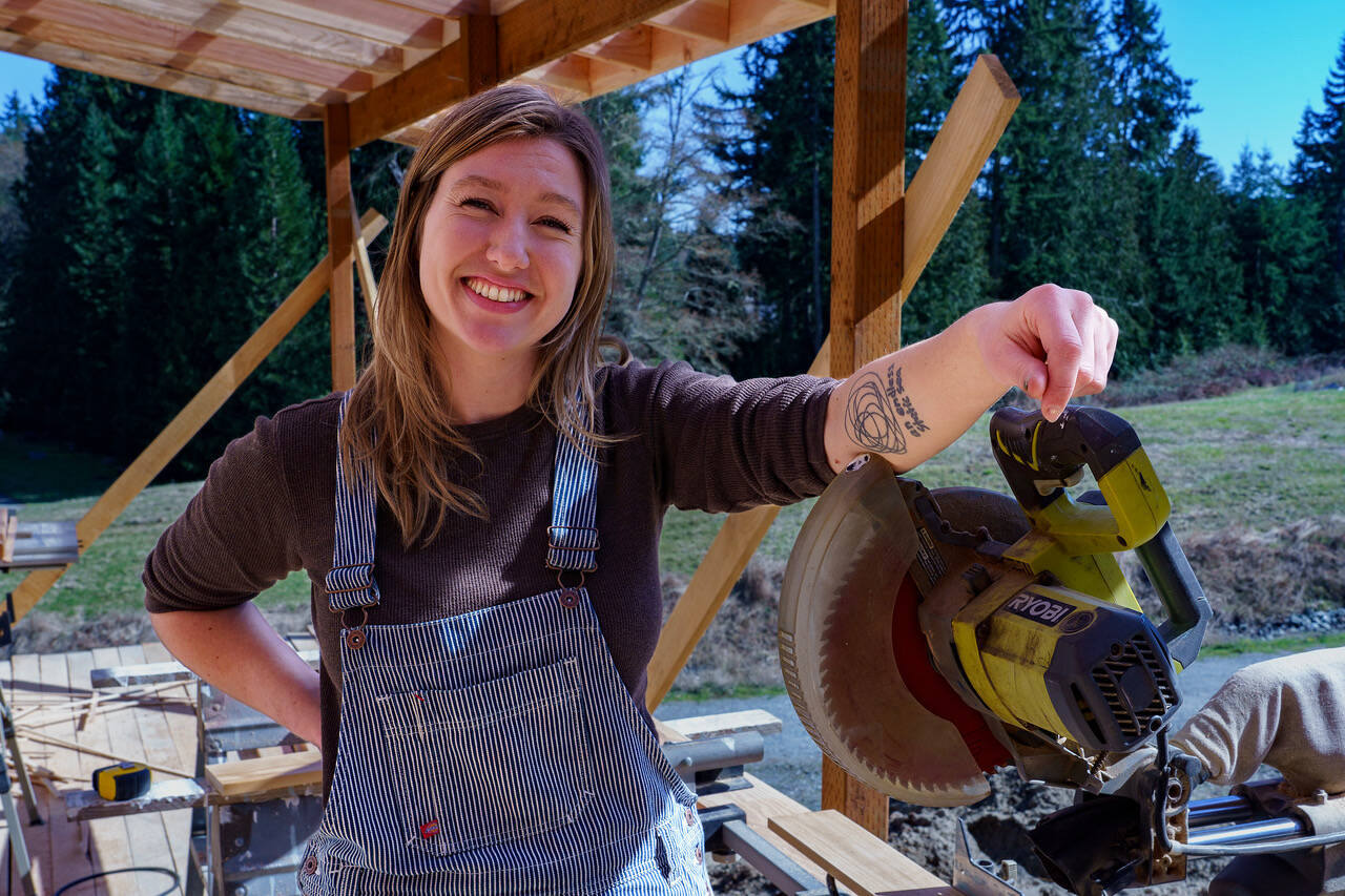Gabbi Korrow, 29, learned all about tools, including the chop saw, when she contributed her own labor to build her own home in 2021 and 2022. (Photo by David Welton)