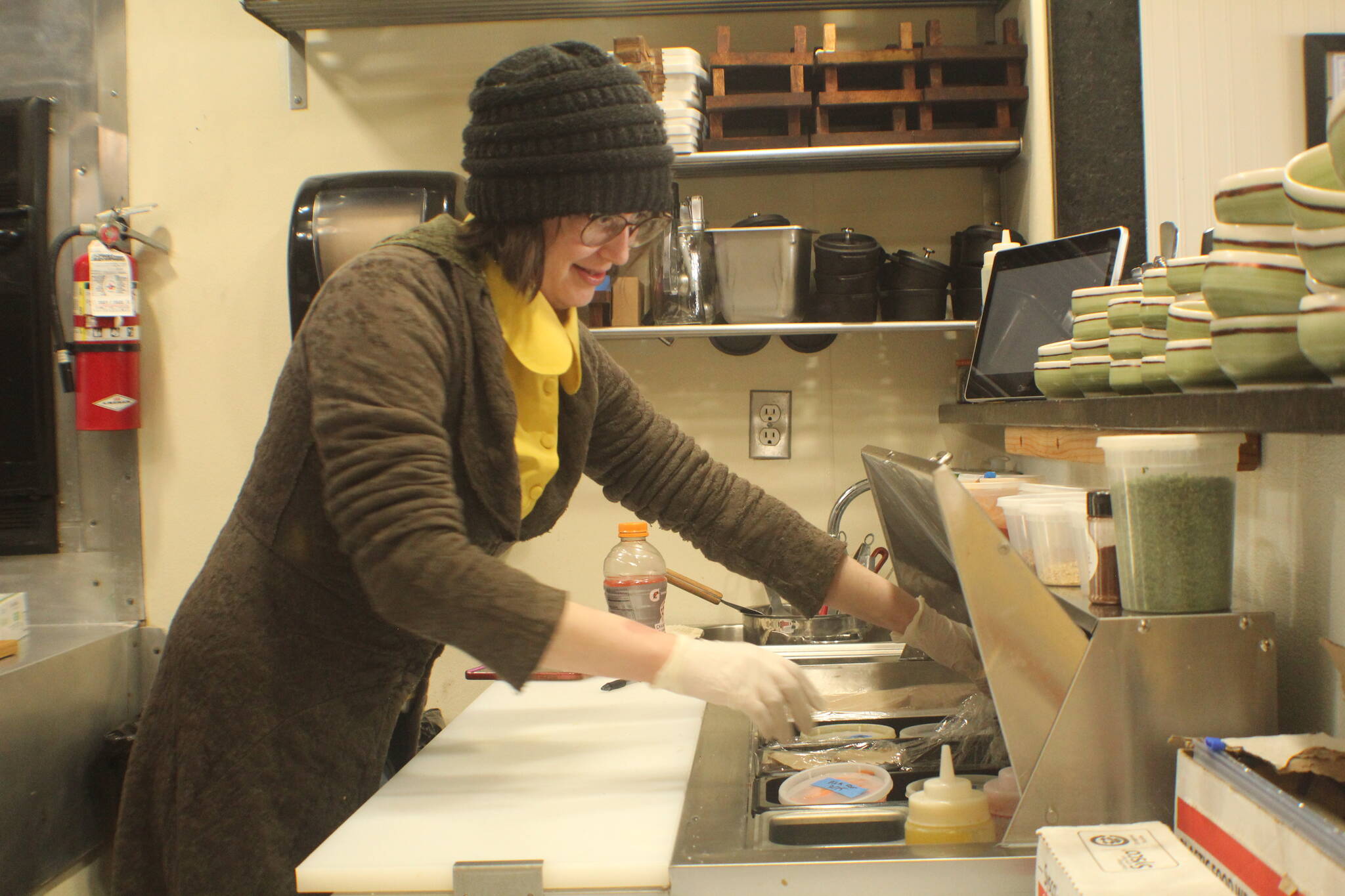 Photo by Karina Andrew/Whidbey News-Times
Lees Datin prepares food in the kitchen at Overboard, a casual Coupeville eatery located at 4 Front Street.