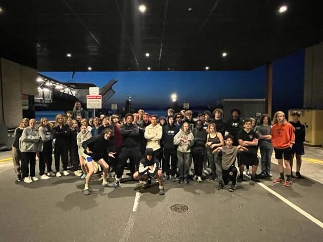The South Whidbey track team waited in the Mukilteo ferry lot for 53 minutes Thursday night before catching the boat home. Coaches said this was more than enough time to stop for food. (Photo provided)