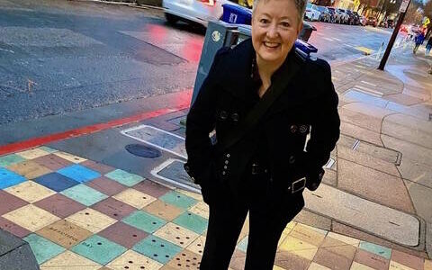 Photo provided
Amy Wheeler, the creator of Play Club, outside Berkeley Repertory Theatre, where members saw “Cambodian Rock Band” in San Francisco in March.