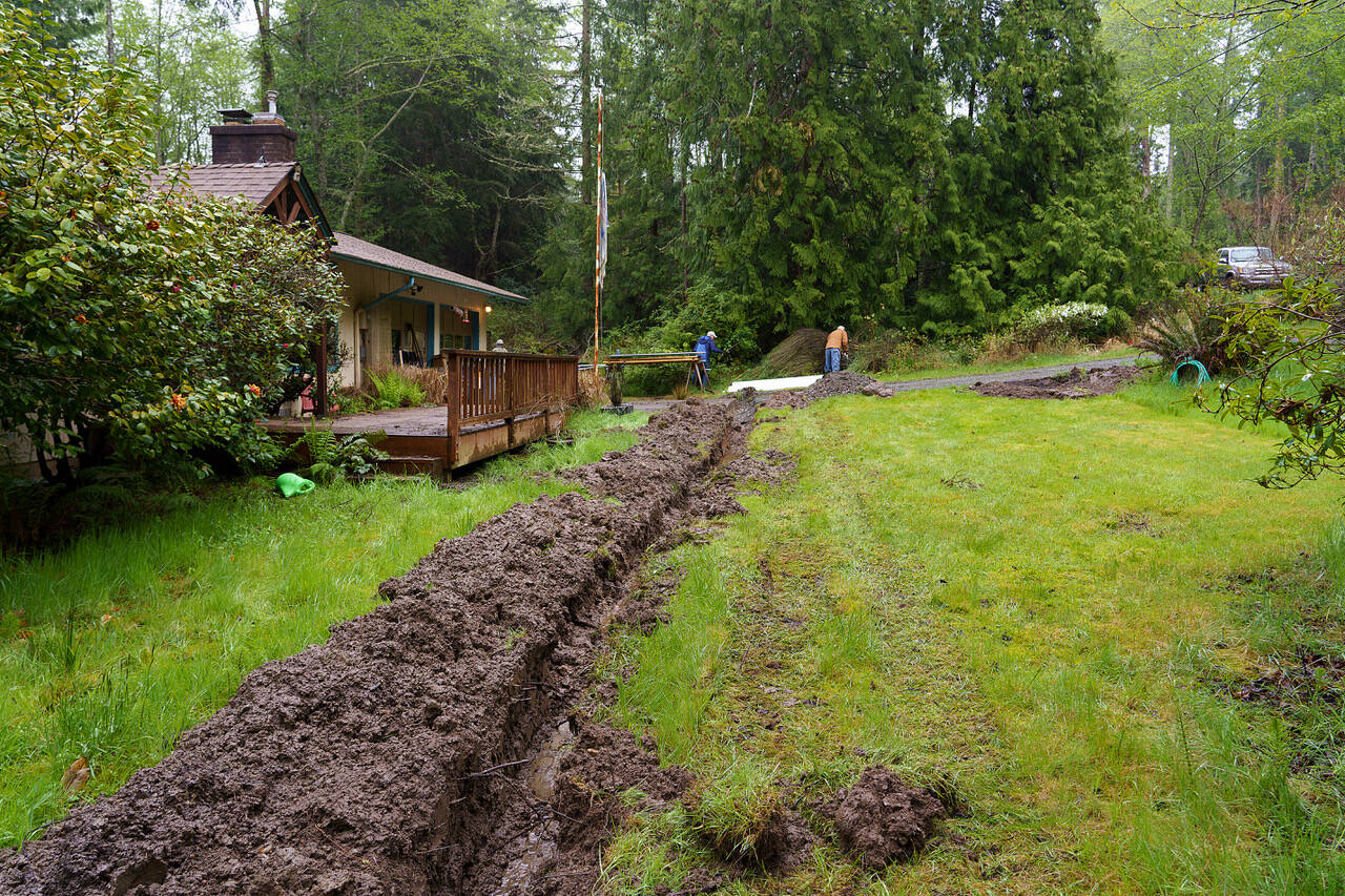Volunteers at a Freeland job site dug an extensive trench, installing a drainage ditch.