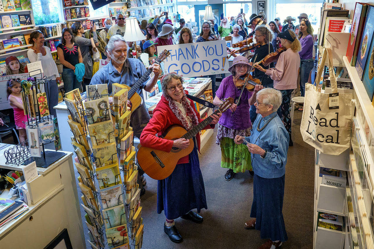 Well-wishers at Moonraker Bookstore bid adieu to the Goods. (Photo by David Welton)