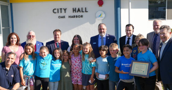 Photo provided
Oak Harbor City Council members present an award of recognition to a Broadview Elementary School third grade class, which submitted the winning name for a new park in the city.