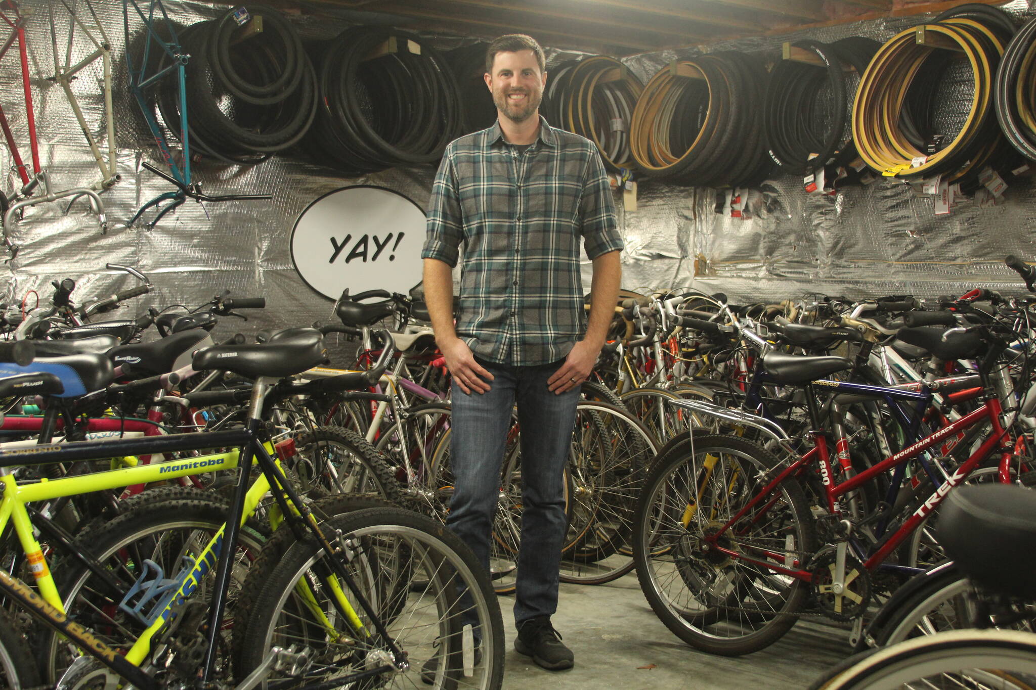 Photo by Karina Andrew/Whidbey News-Times
Trevor Stevens, owner and operator of Celerity Cycles, stands amid his inventory. These bicycles are available on Stevens’s website, and he works with customers to add the upgrades they want to the bikes they purchase.