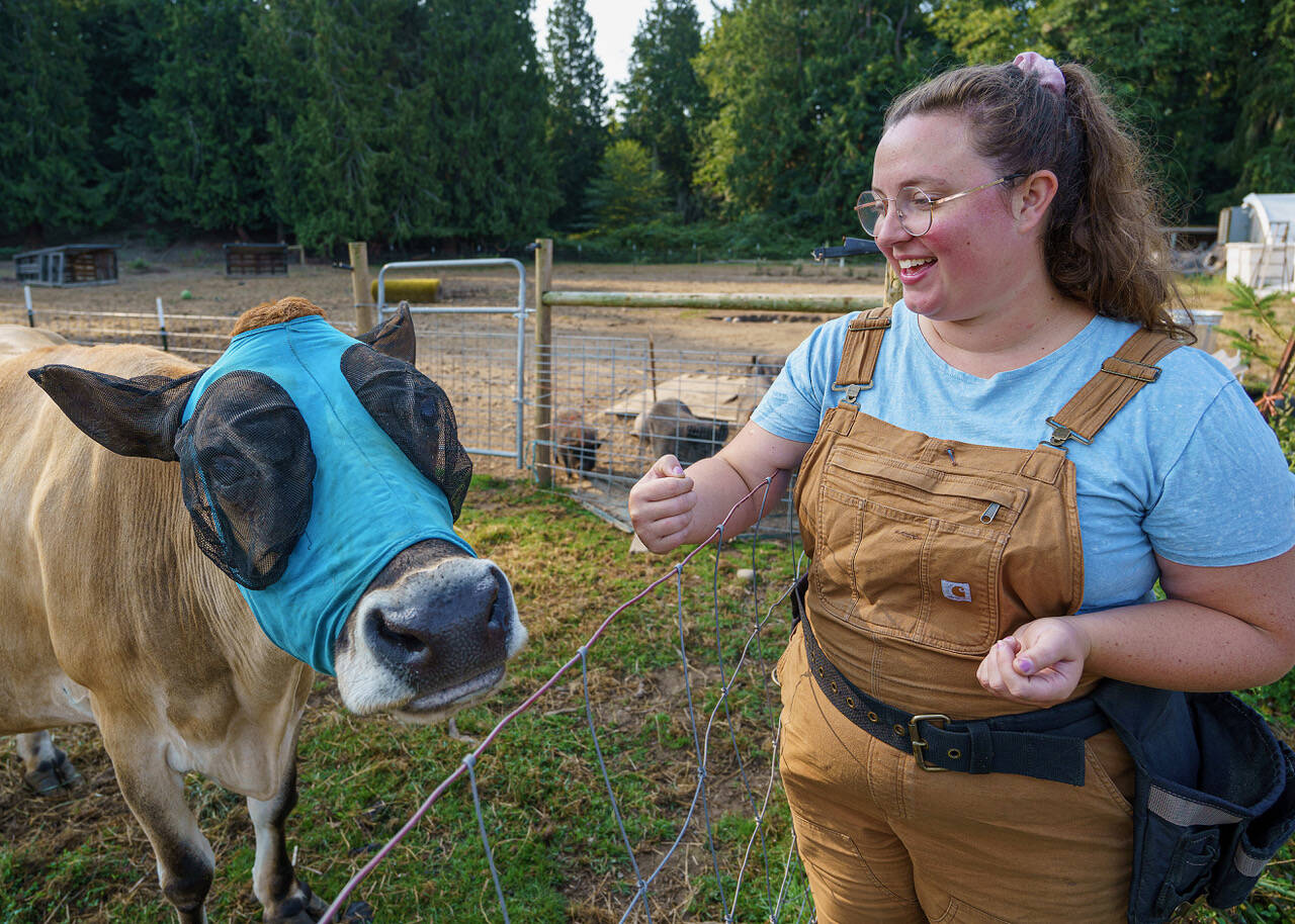 Mackenzie Wright, photographed here with 15-year-old Dahlia the cow, is passionate about taking care of animals. She hopes to be a farm sitter for people looking to take a break or vacation.