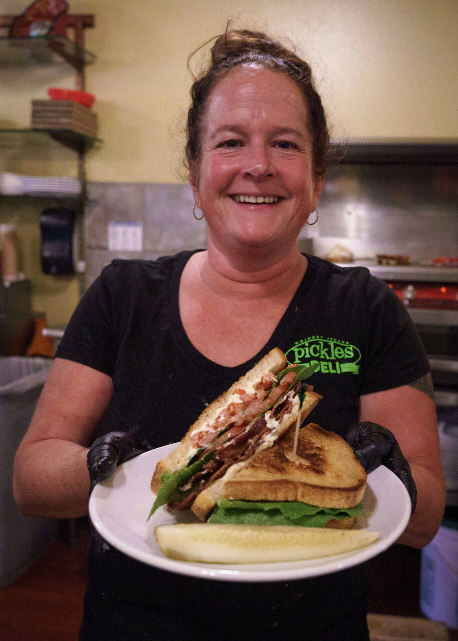 Photo by David Welton
Pickles Deli owner Kim Bailey with a freshly made BLT.