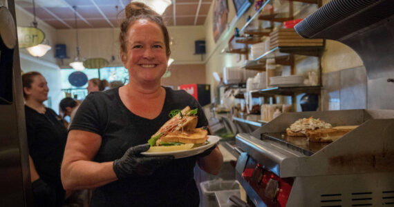 Photo by David Welton
Pickles Deli owner Kim Bailey with a freshly made BLT.