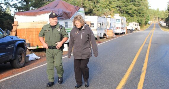 Photo by Luisa Loi / Whidbey News-Times
Island County Sheriff Rick Felici and Commissioner Janet St. Clair take a walk down Hoffman Road as plans are being drawn for relocating RVs.