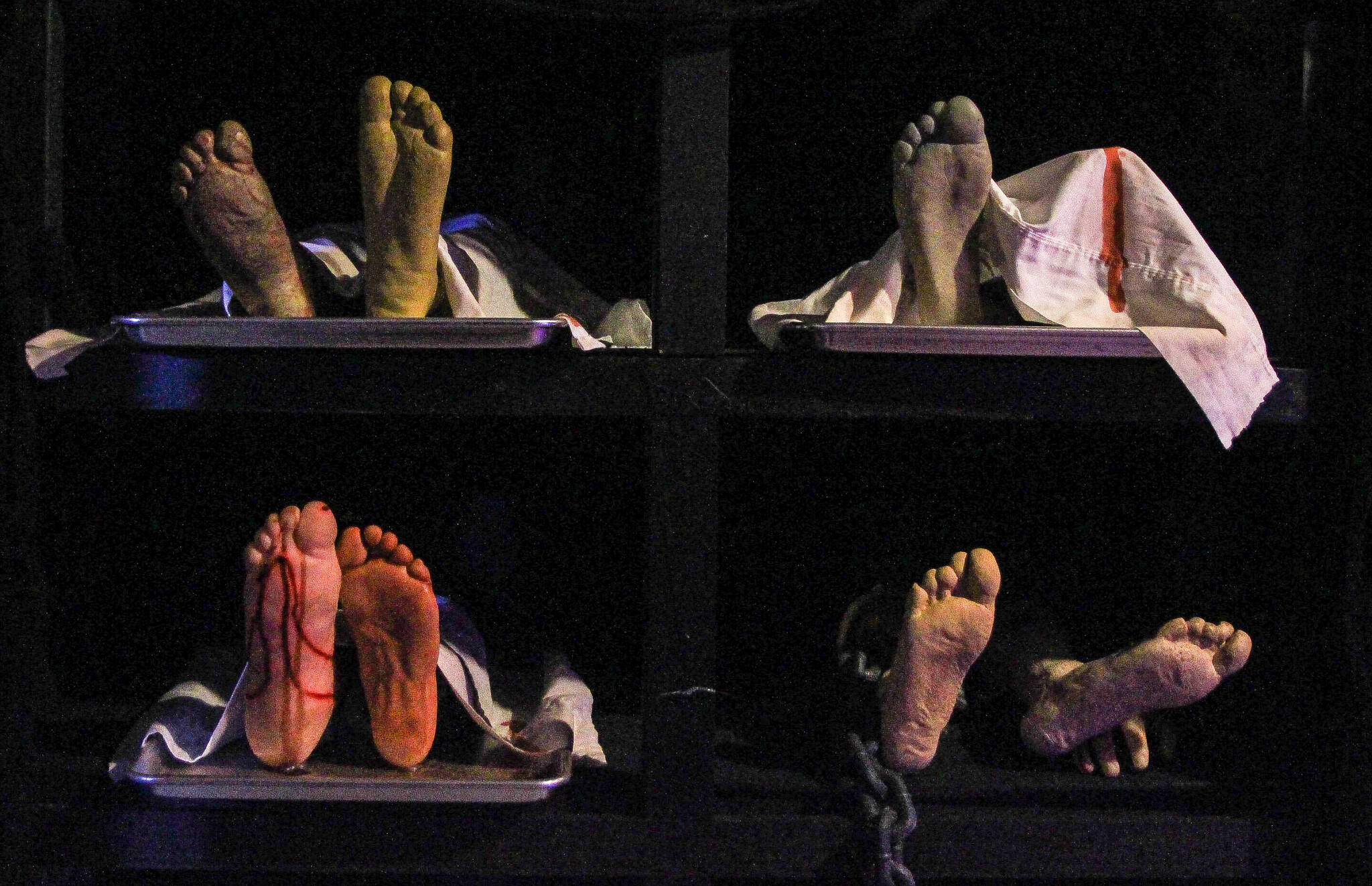 Photo by Luisa Loi
Decaying bodies lay on a body mortuary storage rack.