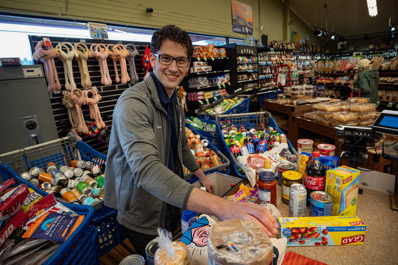 Jadan White, an employee of the Goose Grocer, competed in a bagging competition this week for grocery store courtesy clerks around the state. (Photo by David Welton)