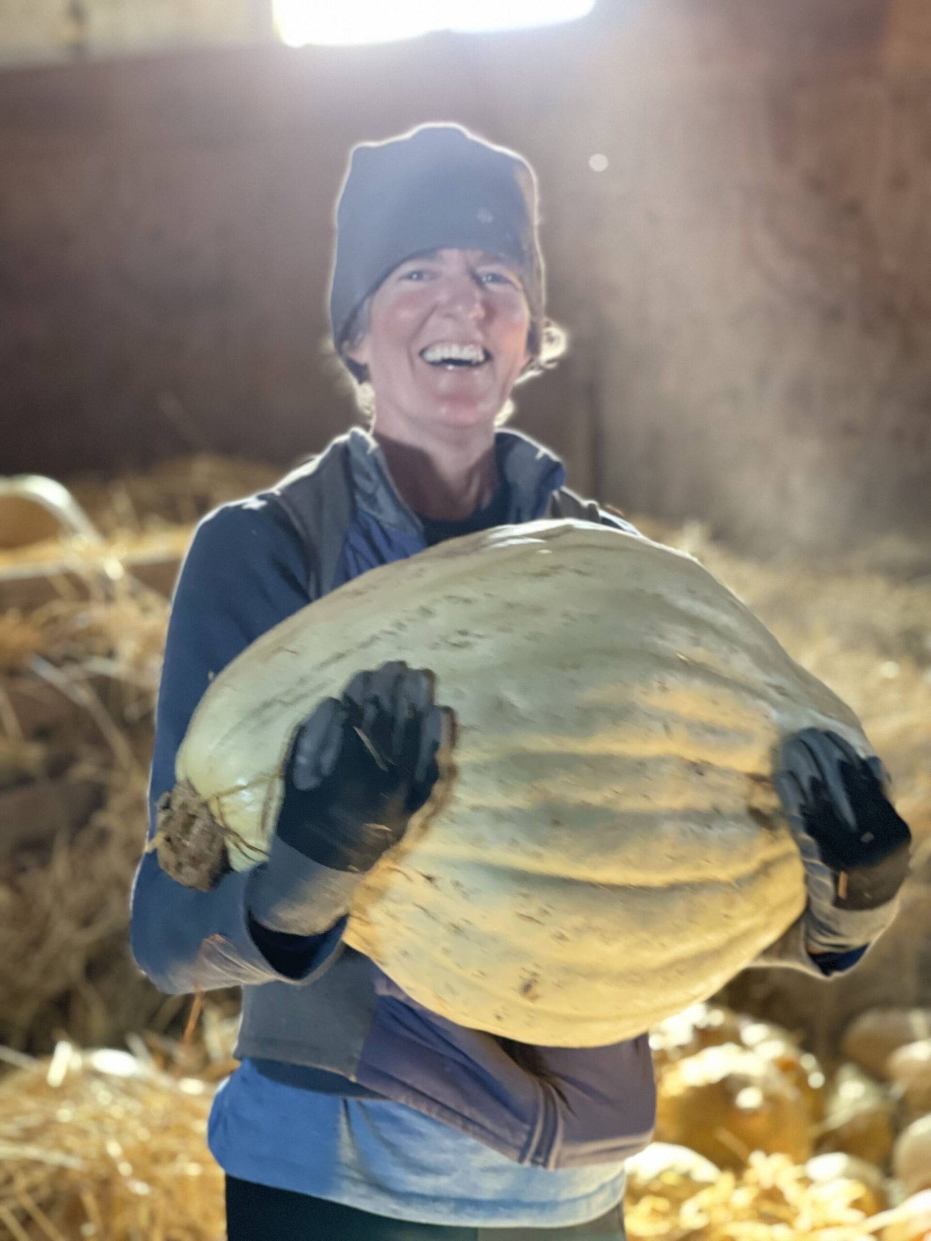 Corrie Chamberlin, Alix Roos’ sister, holds a 44-pound sugar Hubbard squash. (Photo provided)