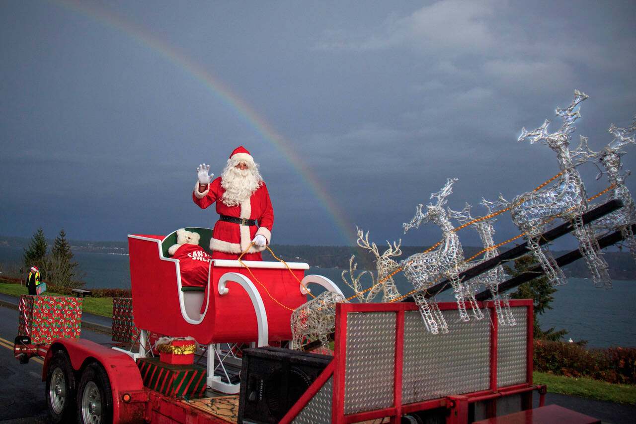 A rainbow greeted Santa Claus in the Village by the Sea during a past year’s Holly Jolly Parade. (Photo by David Welton)