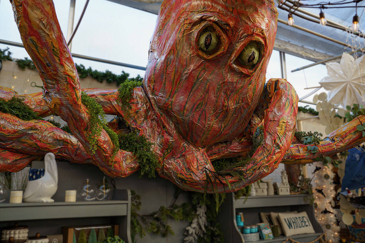 A giant octopus, made by employee Randy Landon, looms over visitors to Bayview Garden’s Holiday House. (Photo by David Welton)