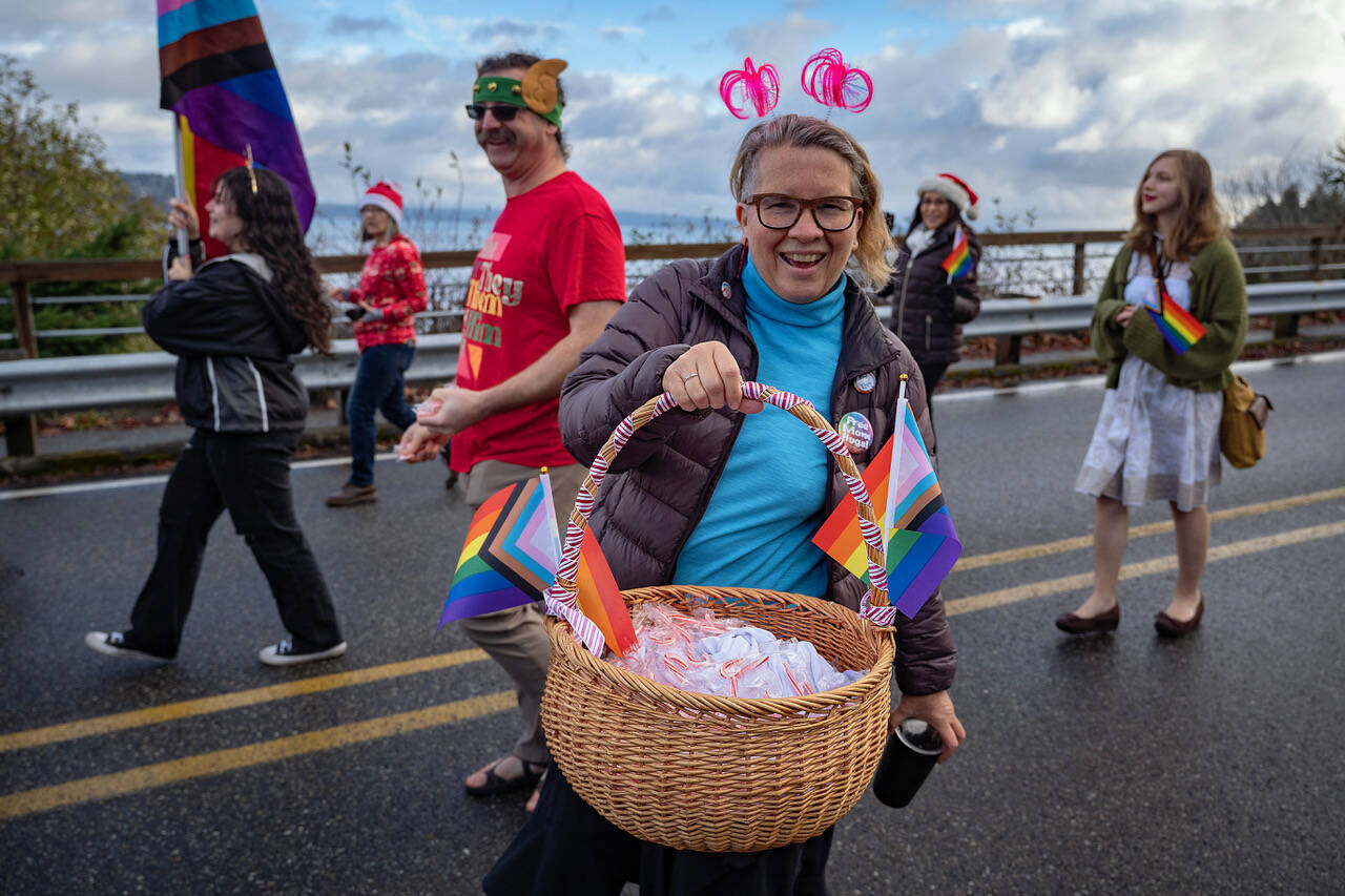 Joan Green handed out candy canes during the parade in Langley. (Photo by David Welton)