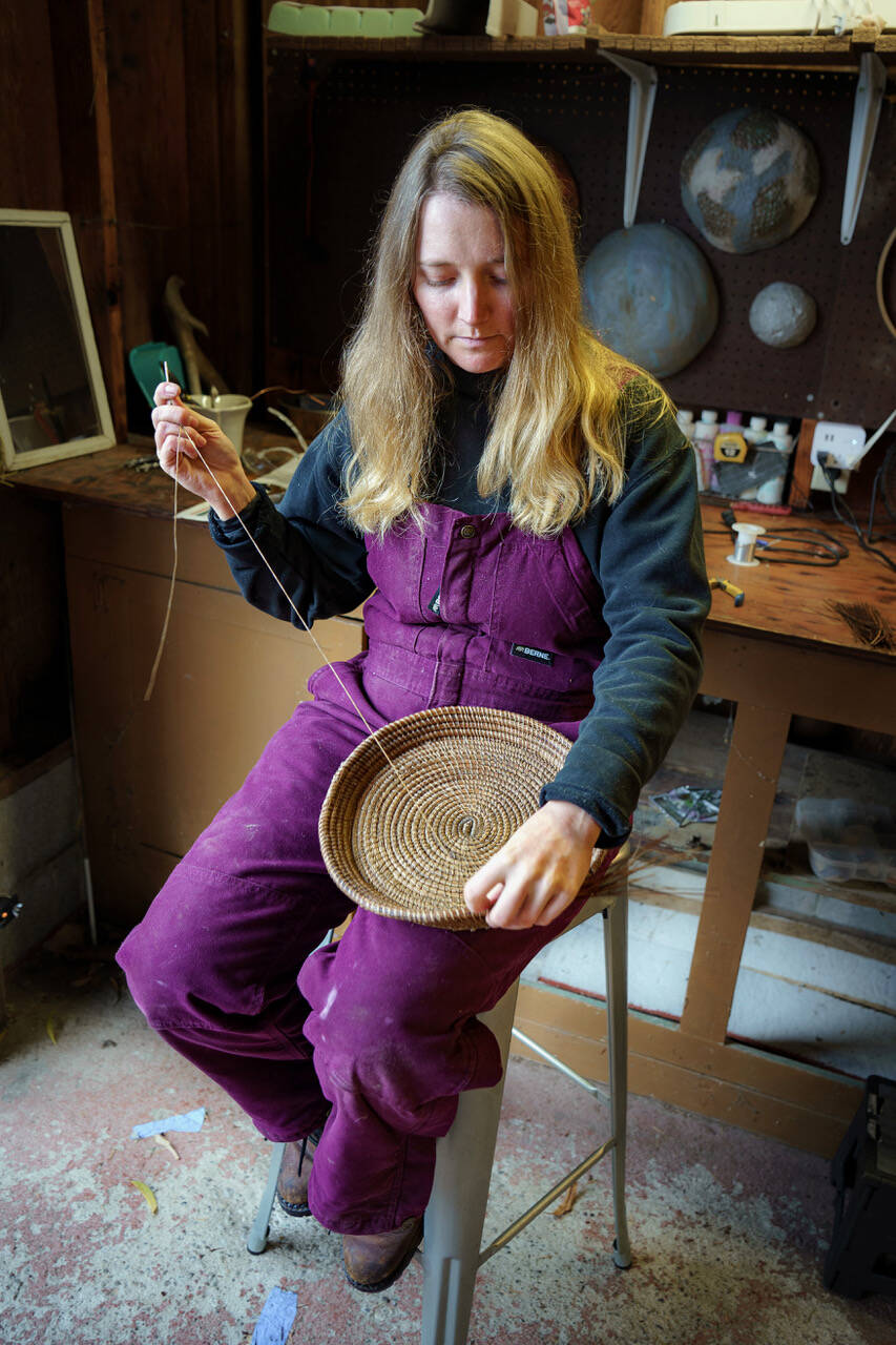 Besides stained glass pieces, Bennett also weaves baskets from pine needles. (Photo by David Welton)