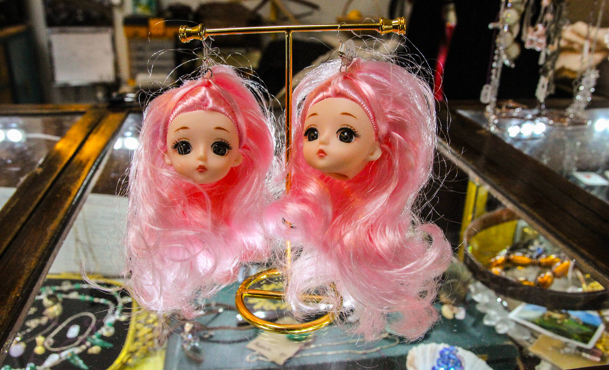 These doll earrings, sold at Dina’s Great Finds, can conquer the heart of any maximalist fashionista. (Photo by Luisa Loi)