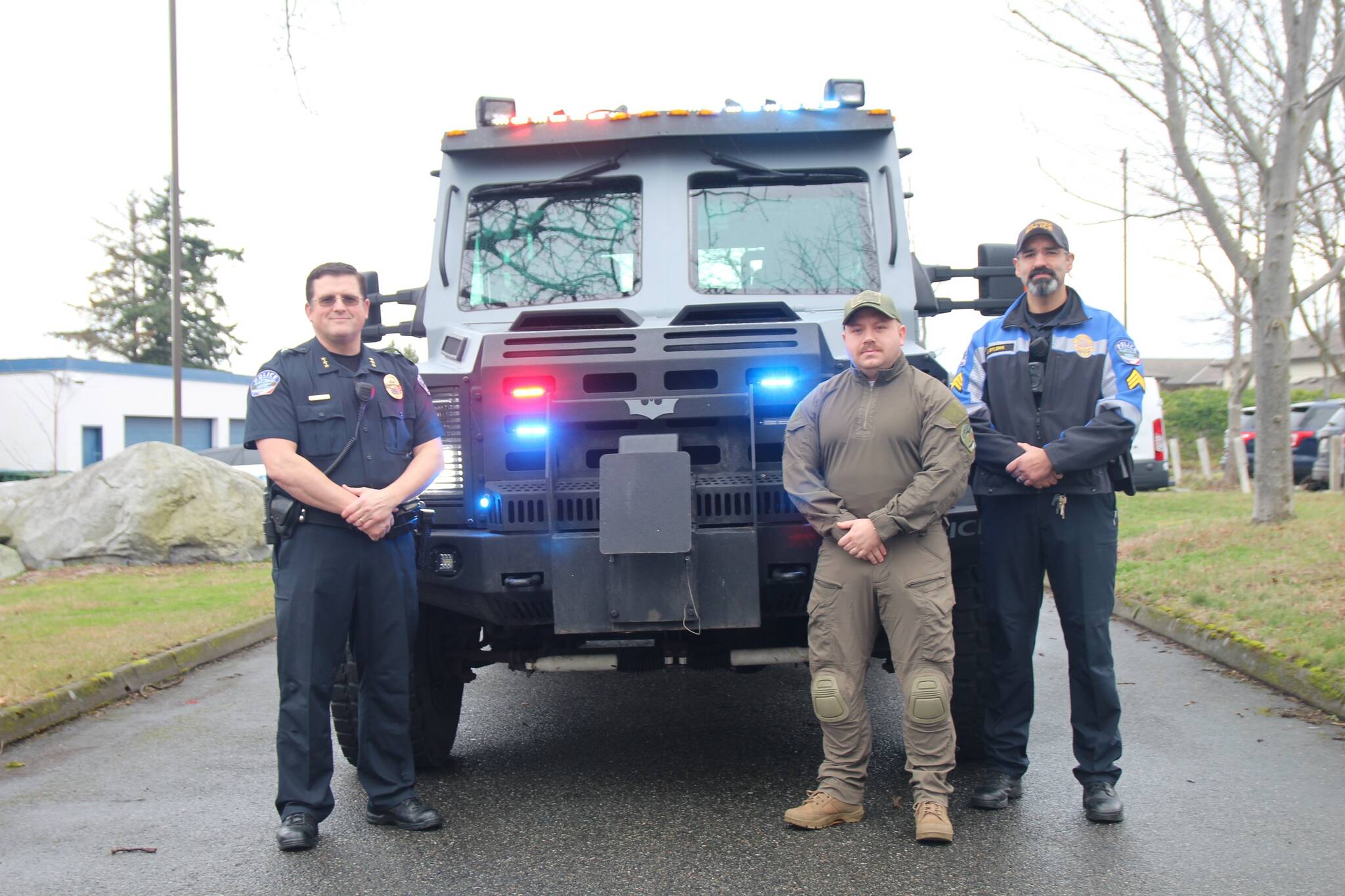 From left, Oak Harbor Police Chief Tony Slowik, Detective Greg Wendell and Sgt. Jon Bylsma stand in front of the BATT. (Photo by Jessie Stensland)