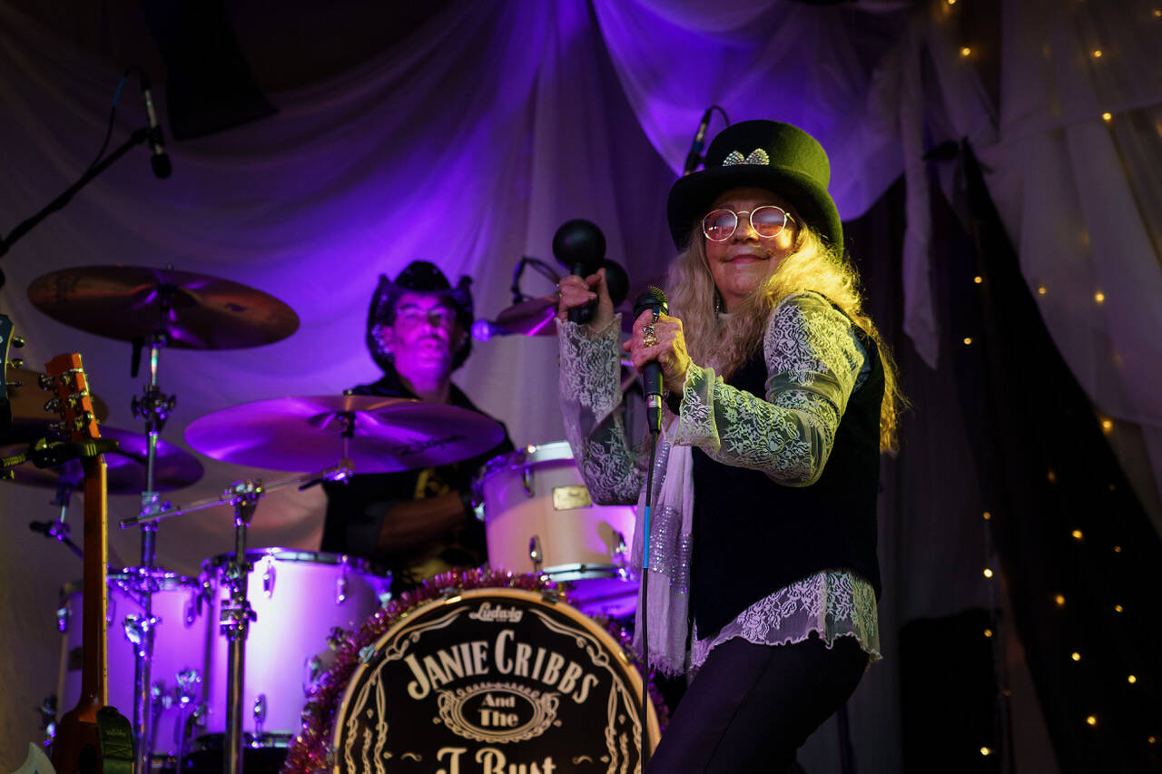 Janie Cribbs and the T.Rust Band play at a previous Mardi Gras party. (Photo by David Welton)