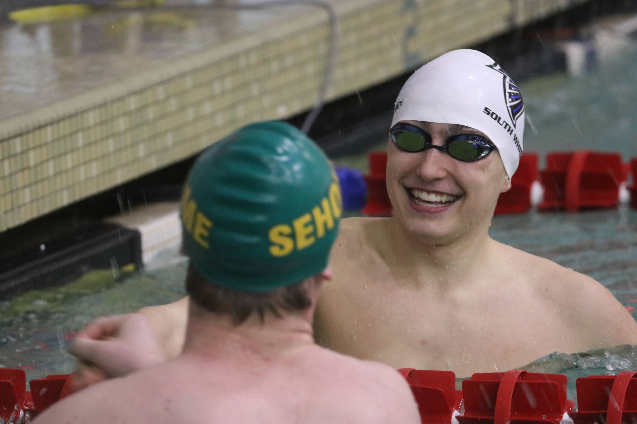 Sophomore Jack Hempel converses with an opponent from Sehome at the district meet. (Photo by Matt Simms)