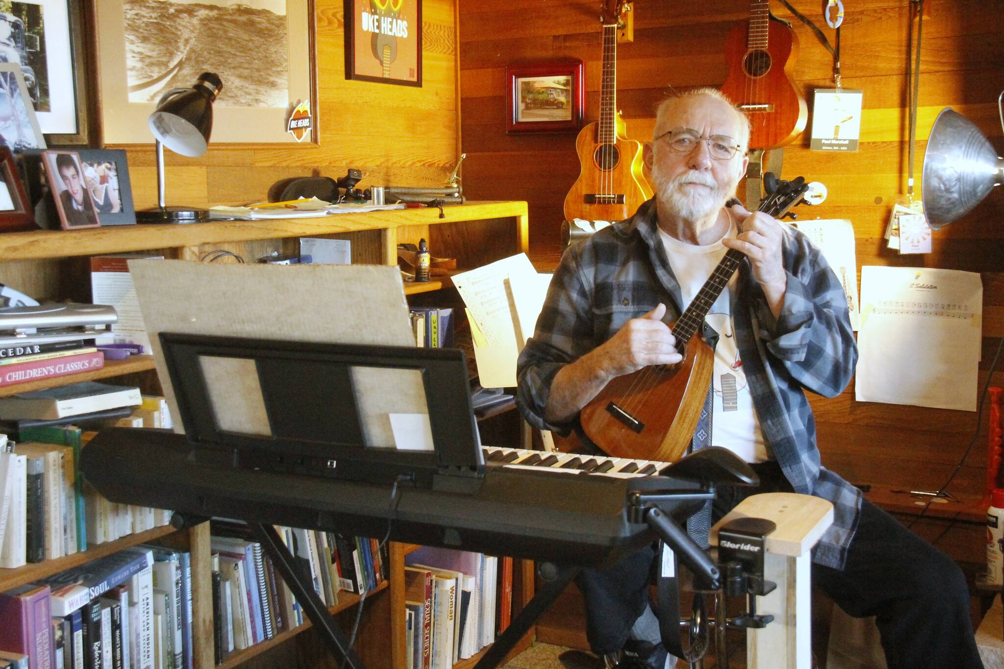 Photo by Kira Erickson/South Whidbey Record
Paul Marshall plays the ukulele in his studio. (Photo by Kira Erickson/South Whidbey Record)