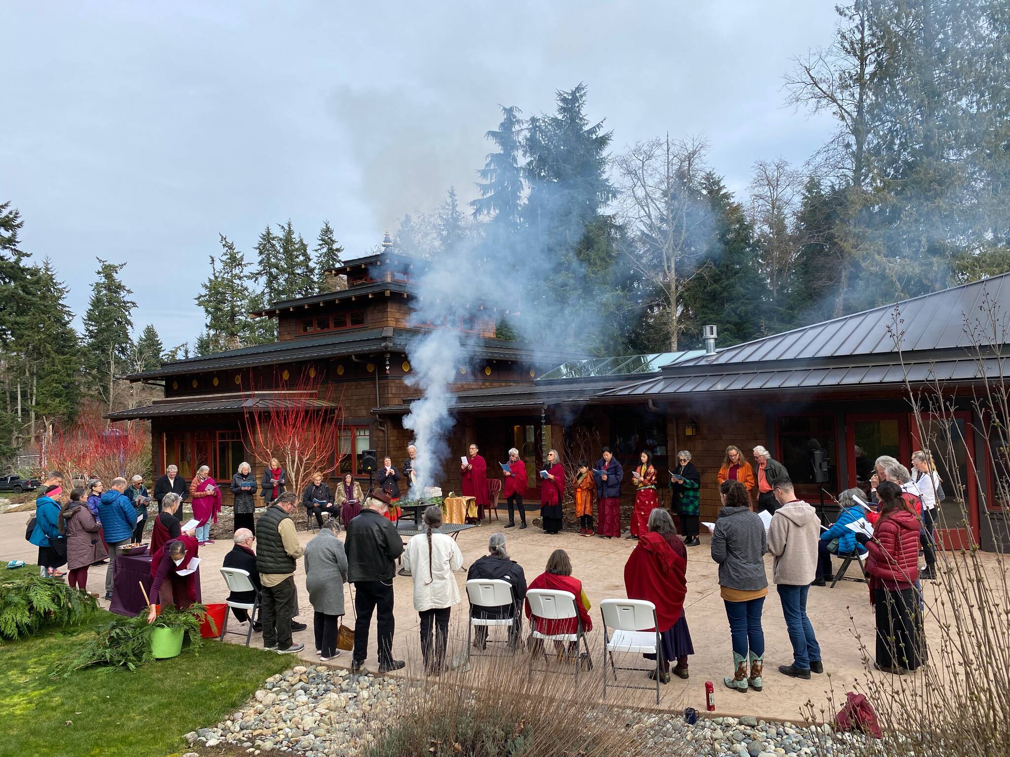 Whidbey Islanders partake in a fire offering ceremony for Losar, Tibetan New Year, earlier this month. (Photo courtesy of the Kilung Foundation)