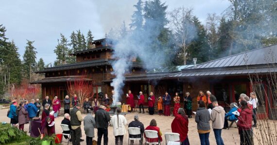 Whidbey Islanders partake in a fire offering ceremony for Losar, Tibetan New Year, earlier this month. (Photo courtesy of the Kilung Foundation)