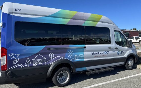 The two newest members of the fleet are the E Ford 350EL model Lightning eMotors battery electric vehicles donning the organization’s brand-new design: stripes of green, blue and purple gradients behind simple linework of orcas, homes, trees and sunshine. (Photo courtesy of Island Transit)