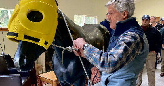 Whidbey horseman Jerry Lloyd demonstrates how to keep a horse safe at an Animal Advocates of Island County meeting on Thursday.