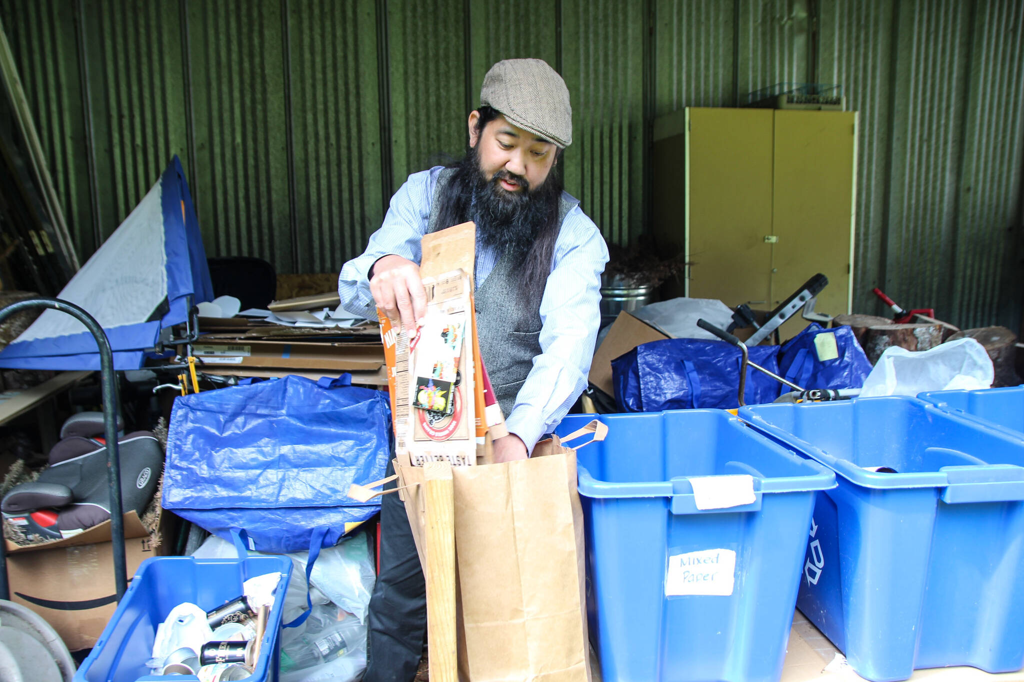 Derek Hoshiko separates his households recyclables. (Photo by Luisa Loi)