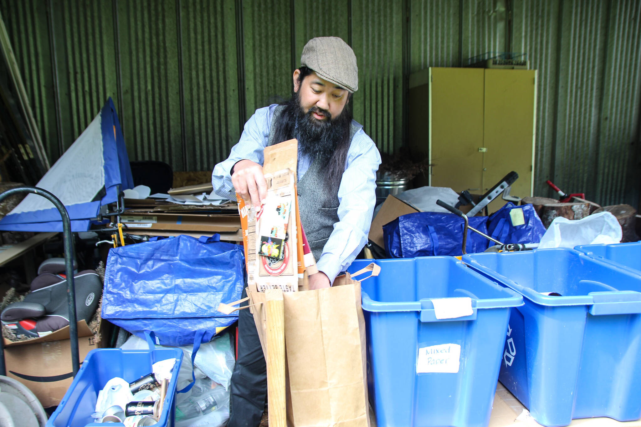 Derek Hoshiko separates his household’s recyclables. (Photo by Luisa Loi)