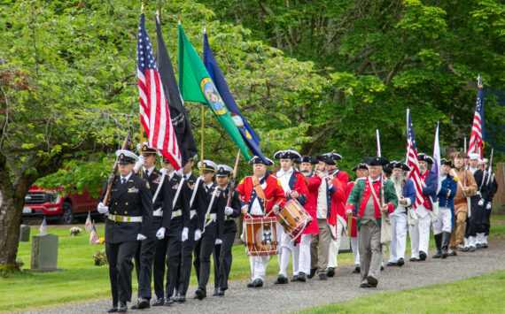 CPO William Thiel, US Navy (Ret) Oak Harbor High School NJROTC Color Guard, Joined by Sones of the American Revolution, George Washington Chapter and USN Sea Cadets Corps, ORION Squadron present the colors at the Memorial Day Service of Remembrance at the Maple Leaf Cemetary, May 27 (photo by Caitlyn Andrson)