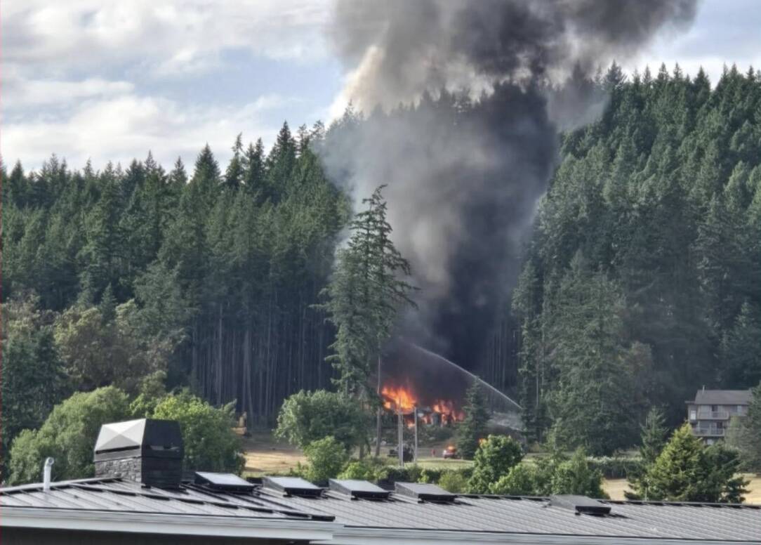 Photo by Cherie Tober A Whidbey Island home caught fire after an explosion.