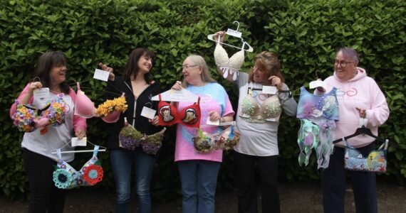 Photo by Marina Blatt
I Support The Girls Whidbey Island volunteers laugh together as they showcase some decorated bras that will be at the auction. From left, Julie Rhodes, Kris Bobadilla, Candy Pearson, Wendy Rue and Kate Mistler